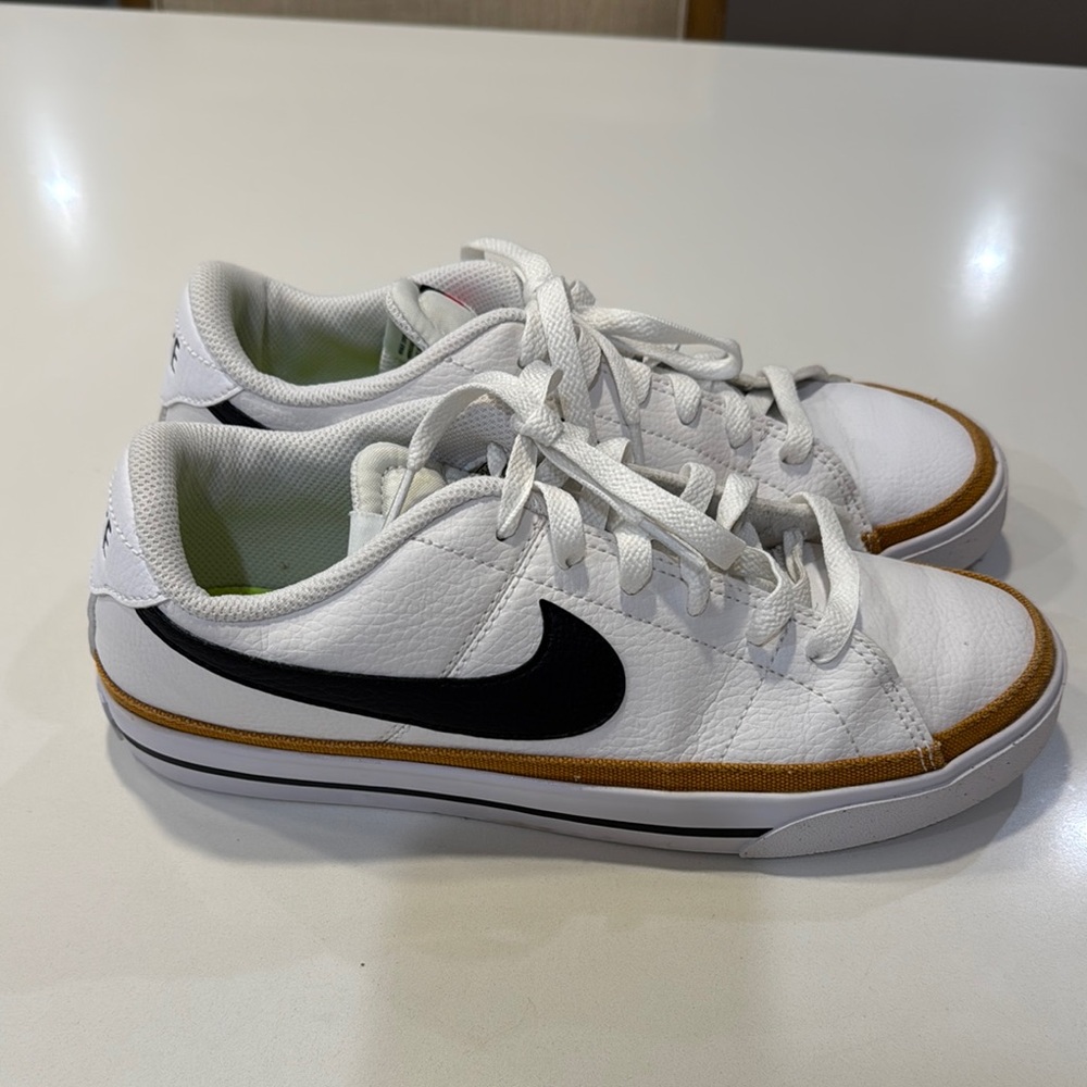 Nike White Sneakers with Black Swoosh and Brown Trim